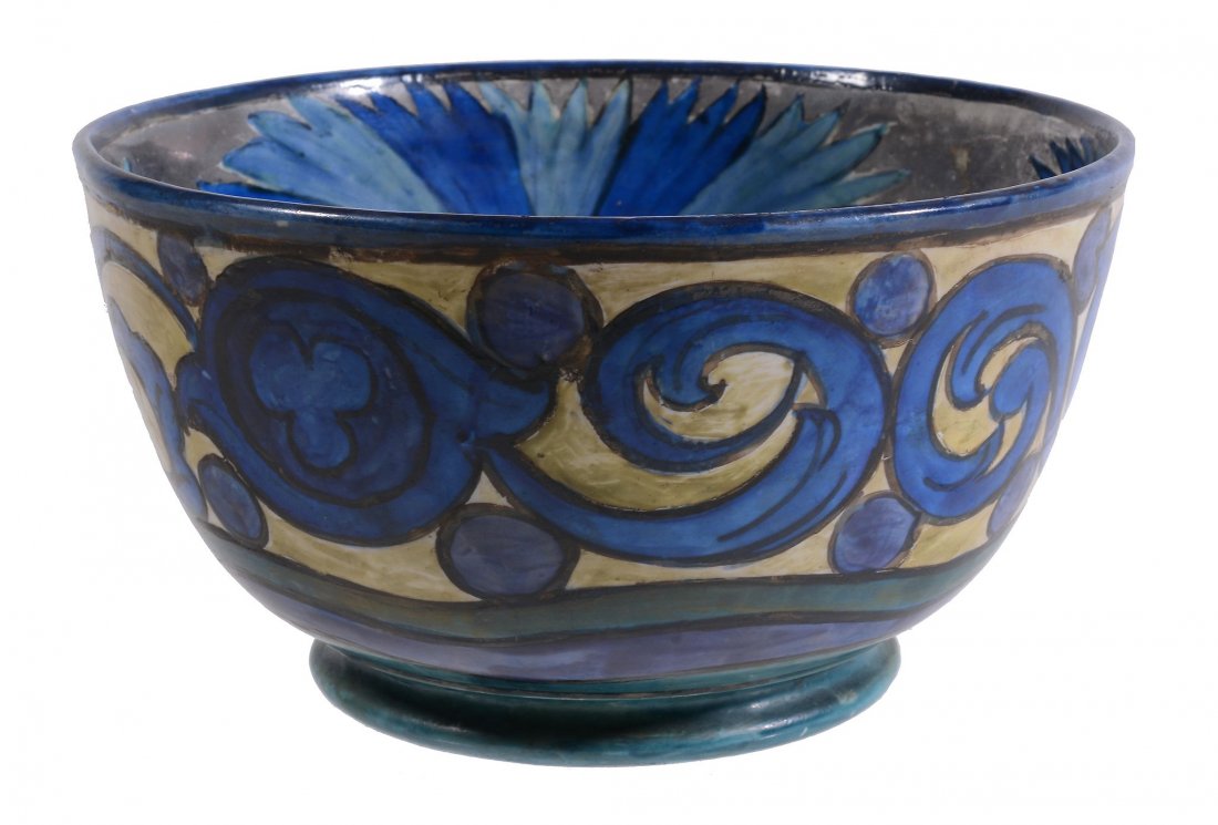 A pottery deep bowl by John Pearson , painted with a: A pottery deep bowl by John Pearson (1859-1930), painted with a broad band of flowers on a silver lustre ground to the interior, the exterior with a broad band of scroll foliage, painted JP monogram a