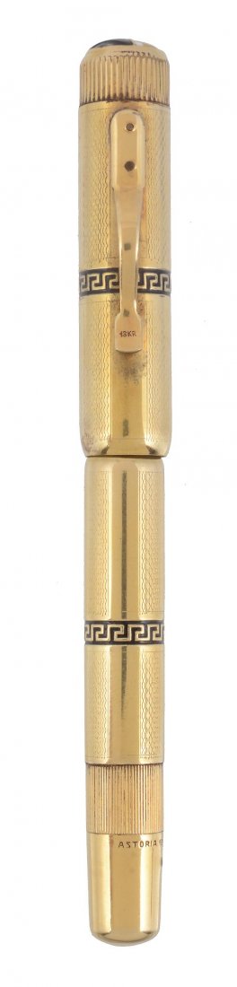 Astoria, a rolled gold Continental overlay safety pen,: Astoria, a rolled gold Continental overlay safety pen, circa 1930, the cap and barrel with engine turned engraving and enamel Greek key bands, stamped Astoria 18KR, the nib stamped Astoria 1 14ct, ink