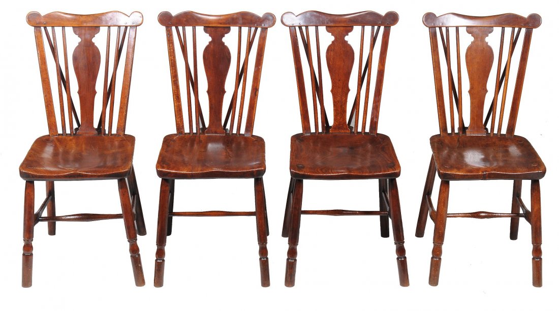 A set of four provincial fruitwood and elm side chairs: A set of four provincial fruitwood and elm side chairs ,18th century, each with curved cresting rail above comb-backs, solid seet, and turned supports joined by H-stretchers For a very similar form of