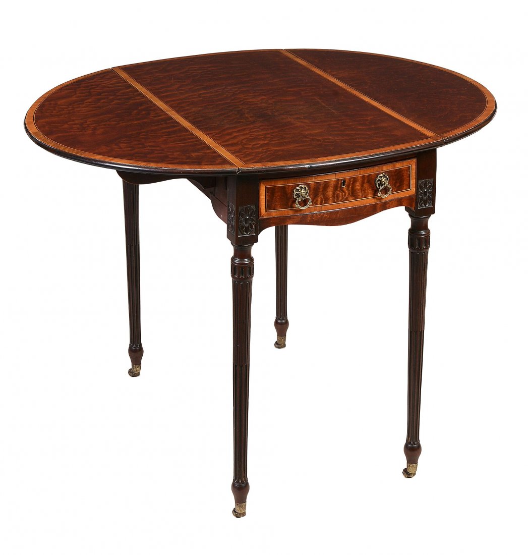A George III fustic, mahogany and satinwood crossbanded: A George III fustic, mahogany and satinwood crossbanded oval Pembroke table, circa 1790, in the manner of Thomas Chippendale, the oval top crossbanded and line inlaid throughout and incorporating twin