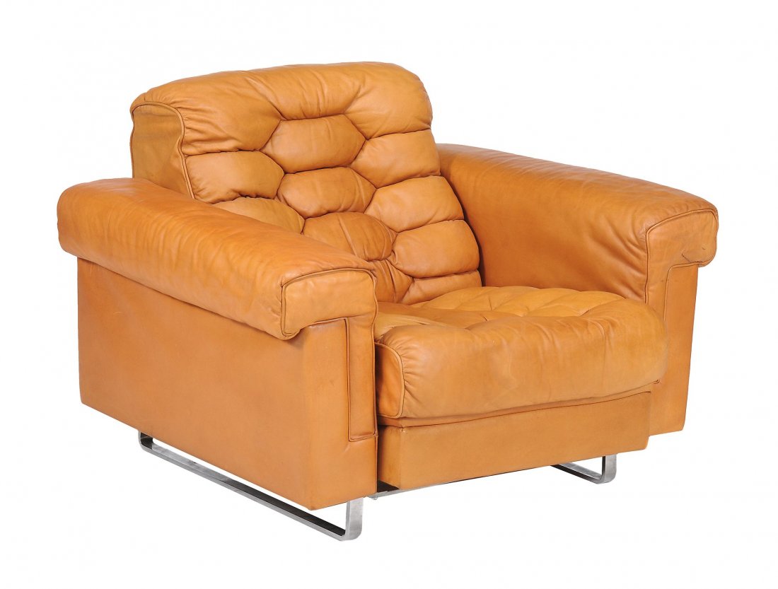 A chrome and tan leather upholstered settee and: A chrome and tan leather upholstered settee and matching armchair, circa 1970, by de Sede, Swiss, the sofa 75cm high, 180cm long, 85cm deep, the chair 75cm high, 100cm wide, 85cm deep Please note: Con