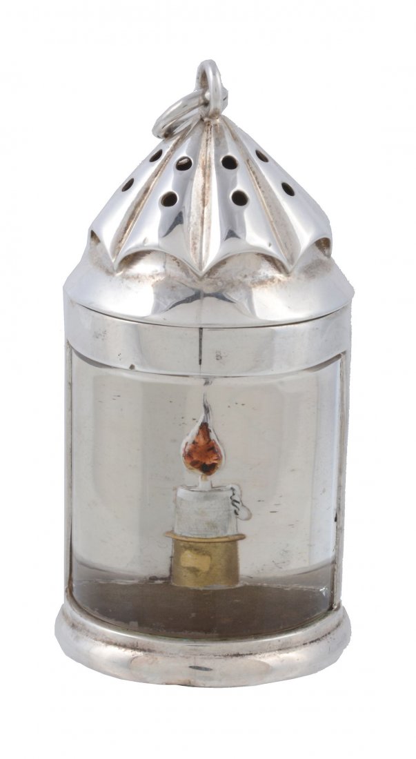 A scarce Victorian silver novelty lantern pepperette by: A scarce Victorian silver novelty lantern pepperette by Thomas Johnson II, London 1881, the dot pierced conical pull-off cover revealing a gilt interior, the glazed aperture with a reverse painted int