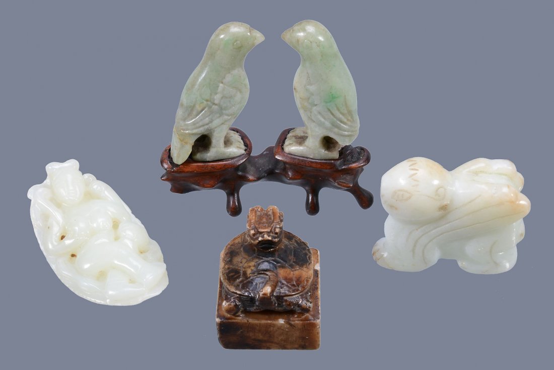 A Chinese pale celadon or white jade pendant of a (1 of 9)