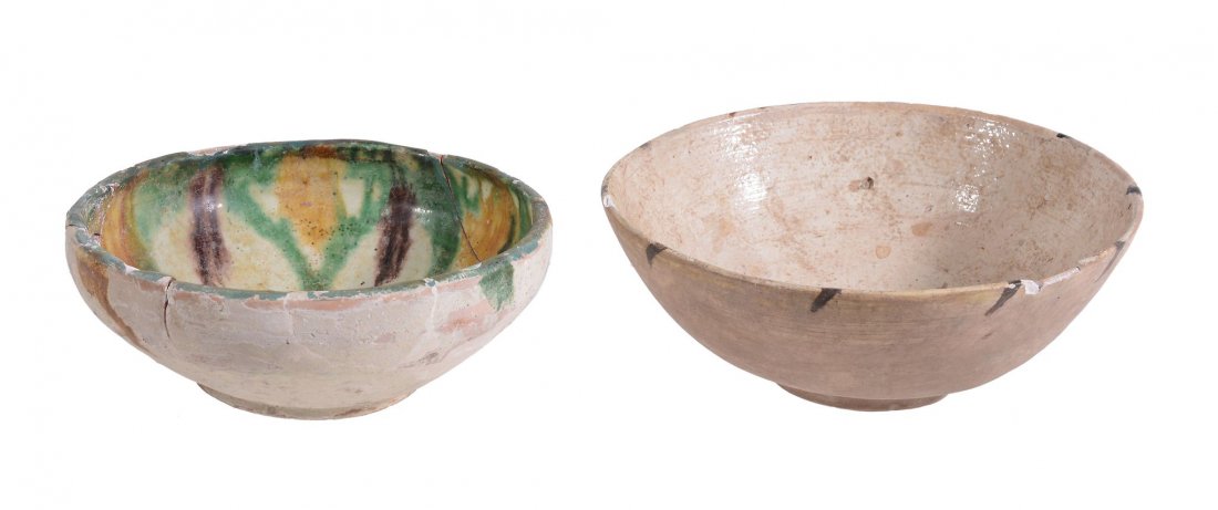 A Byzantine Bowl, of shallow rounded form: A Byzantine (?) Bowl, of shallow rounded form, glazed to the interior in cream with a brown fish painted to the centre and dashes around the rim, diameter 15.7cms; And A Similar Bowl of shallow form d