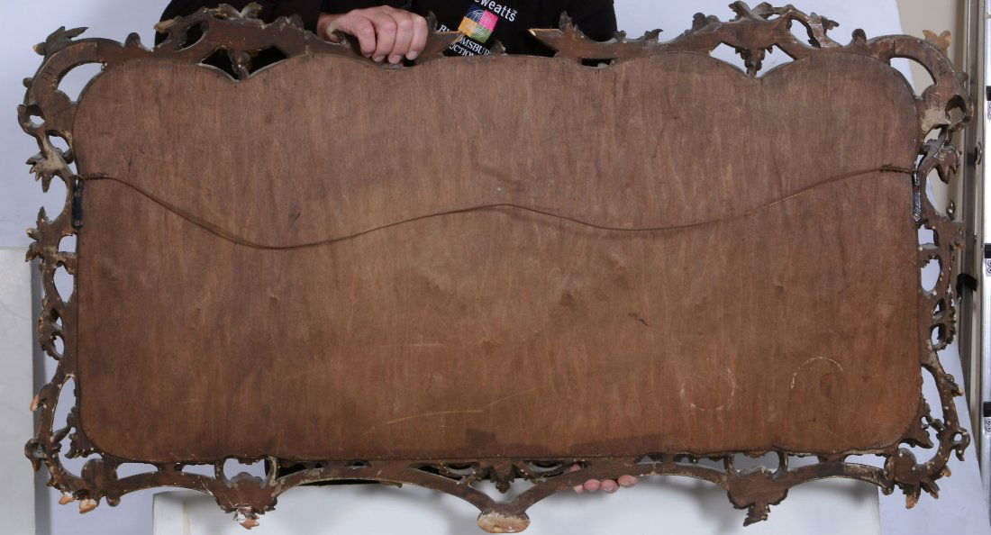 A giltwood triptych wall mirror in George III style: A giltwood triptych wall mirror in George III style, late 19th/early 20th century, after the manner of Thomas Chippendale, 71cm high, 124cm wide