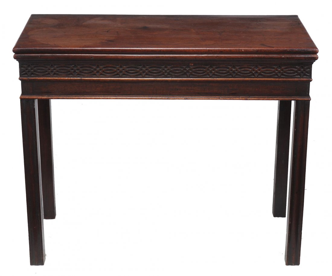 A George III mahogany tea table, circa 1770: A George III mahogany tea table, circa 1770, in the manner of Thomas Chippendale, with blind fretwork frieze, 73cm high, 90cm wide, 43cm deep