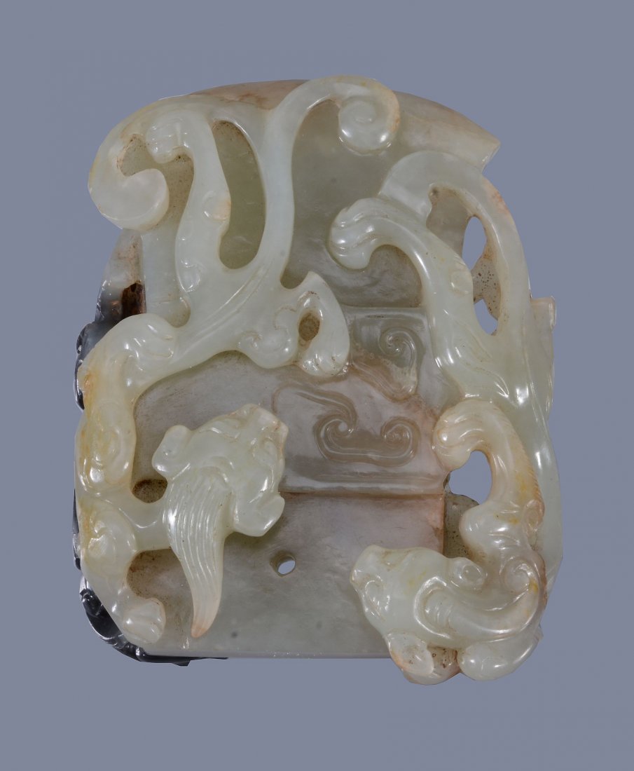 A good pale celadon and black jade 'dragon and axe' (1 of 4)