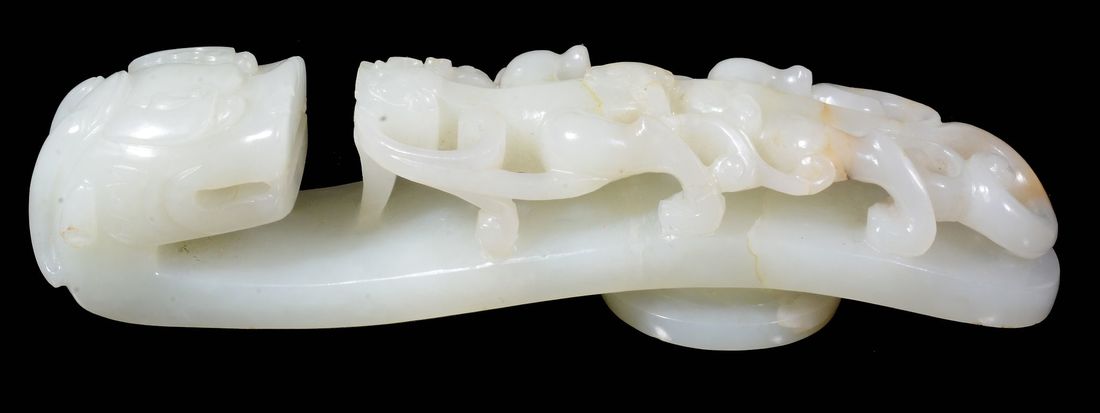 A large Chinese pale celadon jade belt hook (1 of 3)