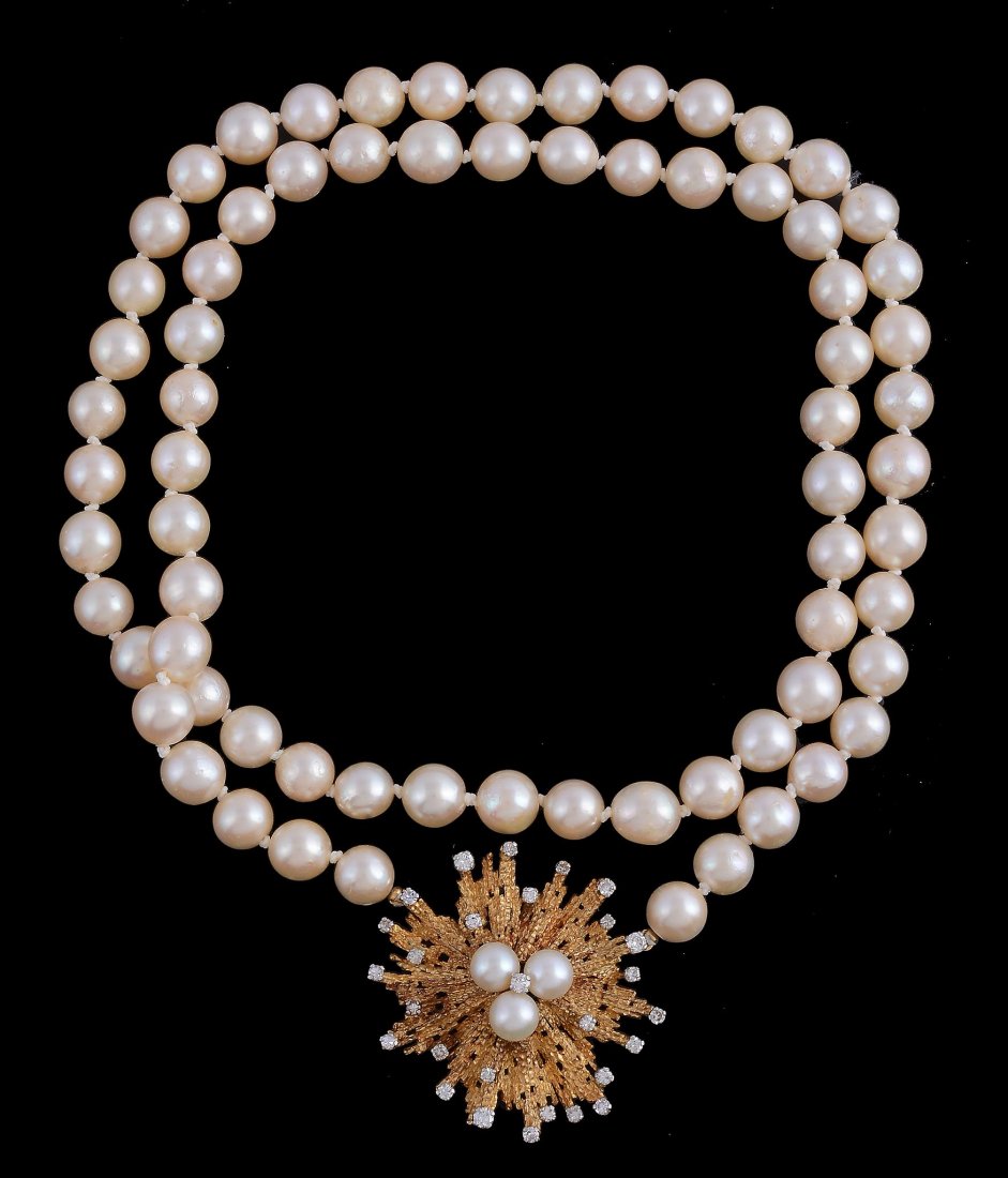 A cultured pearl and diamond necklace by Andrew Grima: A cultured pearl and diamond necklace by Andrew Grima, the central cluster of cultured pearls within a radiating textured surround set with brilliant cut and eight cut diamonds, approximately 1.65 car