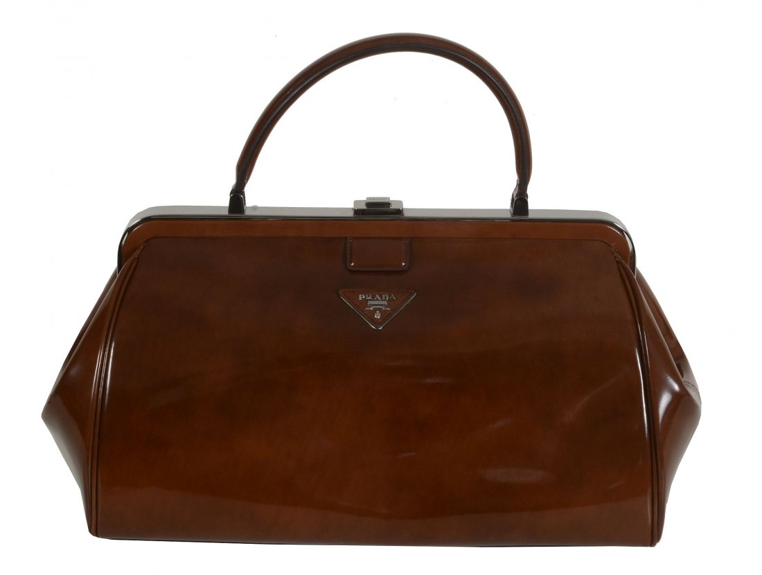 Prada, a brown patent leather handbag , with a single (1 of 4)
