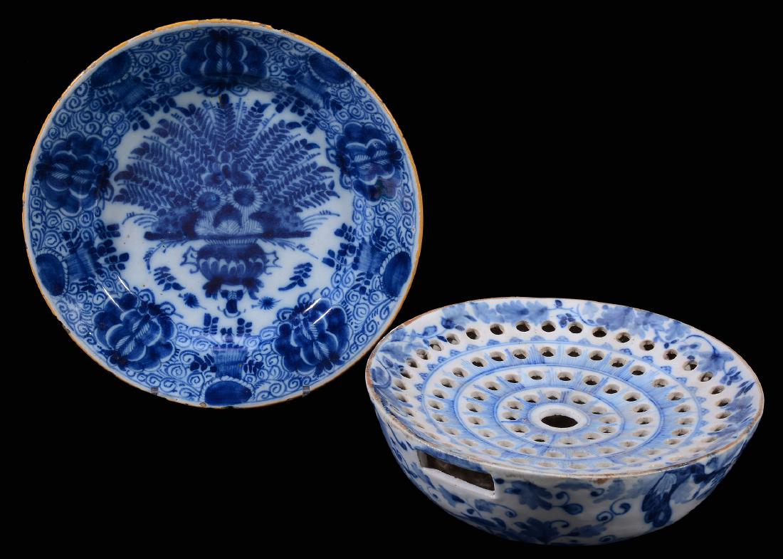 A Dutch Delft blue and white flower-bowl or drainer, (1 of 2)