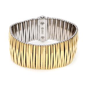 Chimento 18k Two Tone Gold Reversible 31mm Wide Flex: This is a fashionable and chic bracelet by Chimento, it is crafted from 18k yellow and white gold featuring a reversible style with yellow gold on side and white on the other side with long strips. It