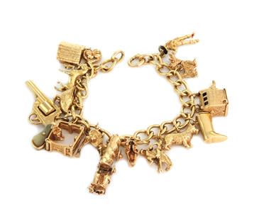 Vintage 14k Yellow Gold 16 Farm's Theme Charms Chain: This bracelet is perfect for a gal who live and work on a farm. It is crafted from 14k yellow gold featuring 16 charms in 3D depicting farm life and items all needed for a farmer. This would be ideal