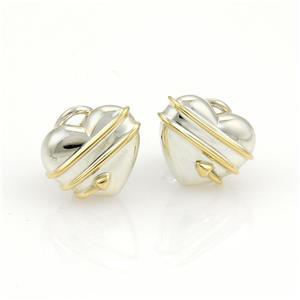 Tiffany & Co. Cupid's Arrow Sterling 18k YGold Hearts Clip On Earrings: This authentic pair of earrings are by Tiffany & Co. from Cupid's Arrow Heart collection. From sterling silver and 18k yellow gold accent. It is in the design of two silver puff hearts with a yellow