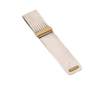 Must de Cartier Vintage Two Tone Gold Metal Rib Style Money Clip France: This is an authentic vintage money clip from the Must de Cartier, it is crafted from white and yellow gold plated metal featuring a long wide rib style and the clip has yellow gold rib band accent.