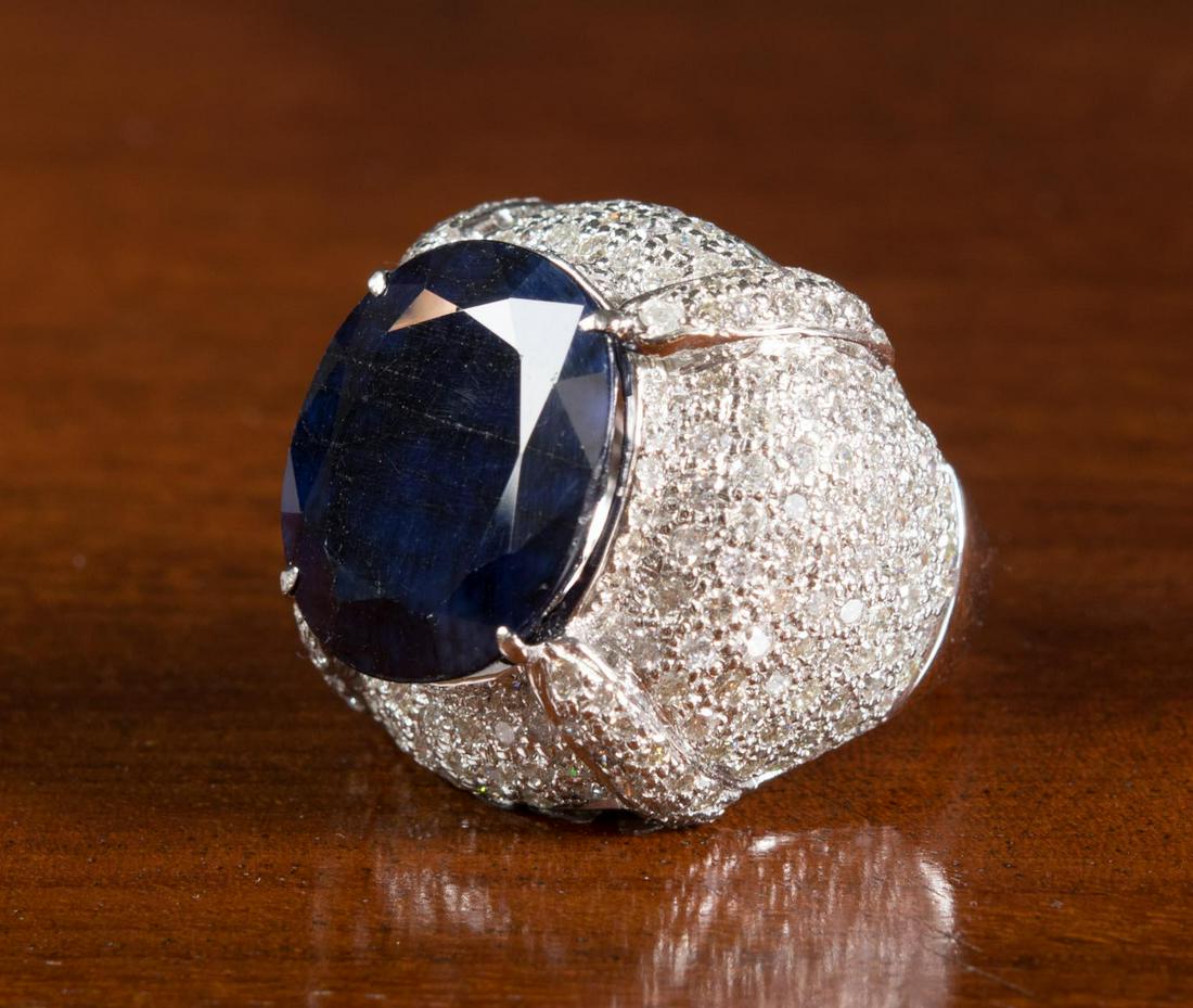 SAPPHIRE, DIAMOND AND EIGHTEEN KARAT GOLD RING (1 of 4)