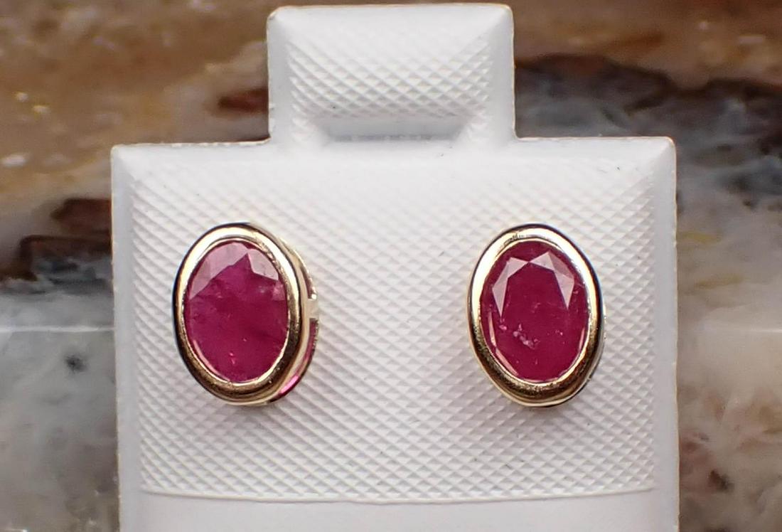 PAIR OF RUBY AND FOURTEEN KARAT GOLD EAR STUDS (1 of 2)