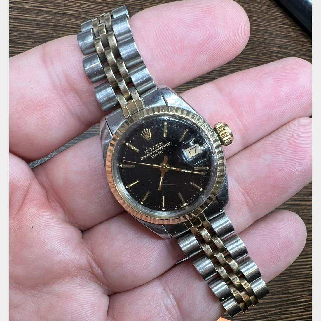 Rolex Stainless Steel and Gold Ladies DateJust: Rolex Stainless Steel and Gold Ladies DateJustWeighing 52.7 gramsModel #6917Circa 1980 (6 million serial number)26mm Case18K Yellow Gold Fluted BezelSteel/Gold Jubilee BraceletAutomatic MovementBlack