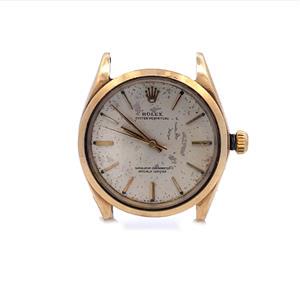 Vintage Rolex Manual Wind 14k Yellow Gold Men's Watch 1002: This vintage authentic handwind chronometer men's wristwatch by Rolex . The case is crafted from 14k yellow gold without band. The face is gold with polished gold stick hourmarkers and hands. It is ha