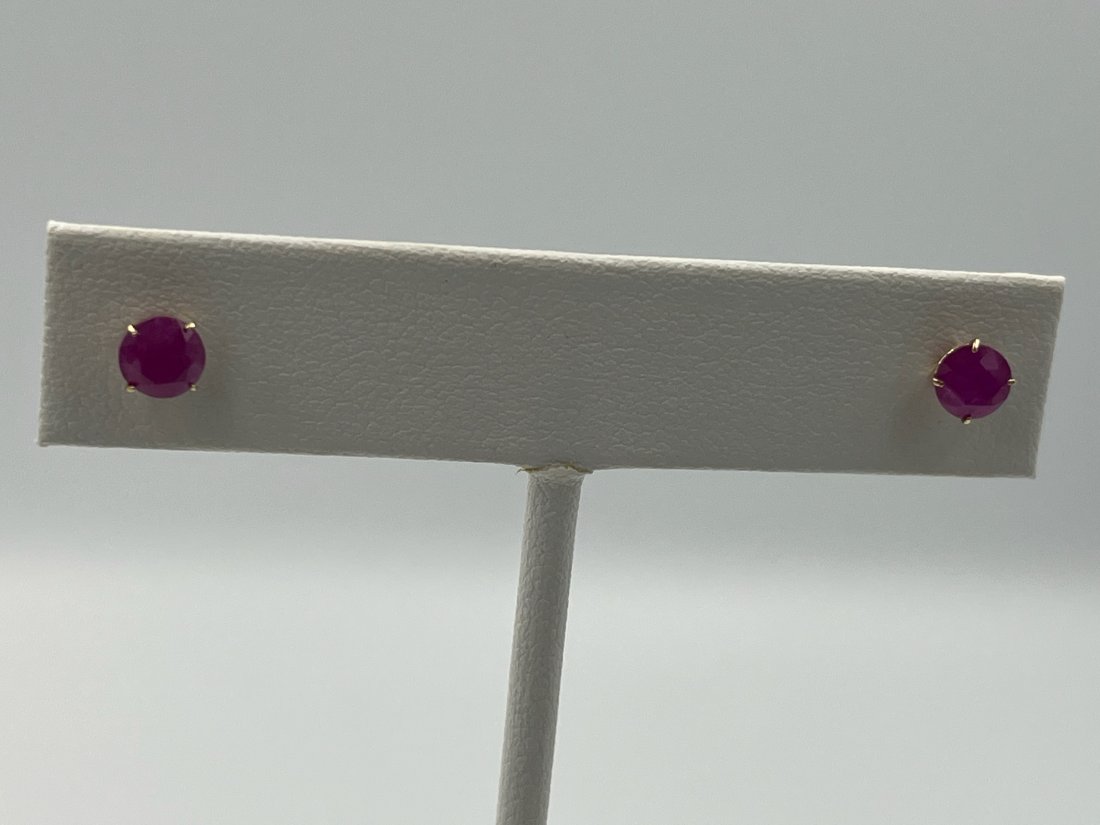 GORGEOUS RUBY STUD ER 14K Y/ GOLD: GORGEOUS RUBY STUD ER 14K Y/ GOLD. These earrings are set with two 5mm round ruby, in a four prong setting. They are set in 14k yellow gold.