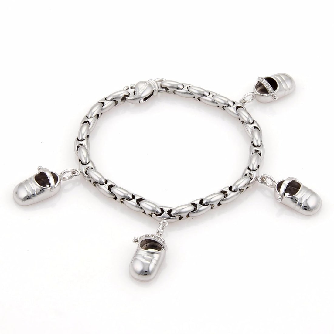 Chimento Charm Bracelet 18k White Gold Diamond 14k White Gold 4 Shoe Charms: This is an authentic charm bracelet from Chimento, it is crafted from solid 18k white gold in a high polished finish and features fancy paddy chain links, there are 4 charms dangling from the bracelet