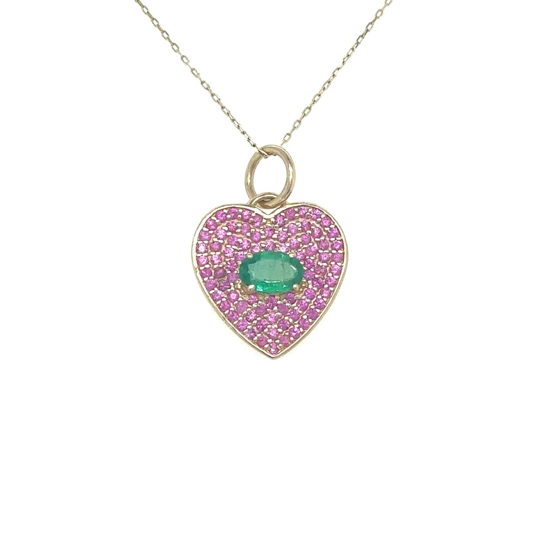 14KT YELLOW GOLD HEART PENDANT WITH EMERALD AND PINK SAPPHIRE: 14KT YELLOW GOLD HEART PENDANT WITH EMERALD AND PINK SAPPHIRE14KT. GOLD WT. APPROX. 1.31 GRAMEMERALD WT. APPROX. 0.40 CARATSAPPHIRE WT. APPROX. 0.60 CARAT / 80 PCSPRICE IS ONLY FOR PENDANT WITHOUT CHA