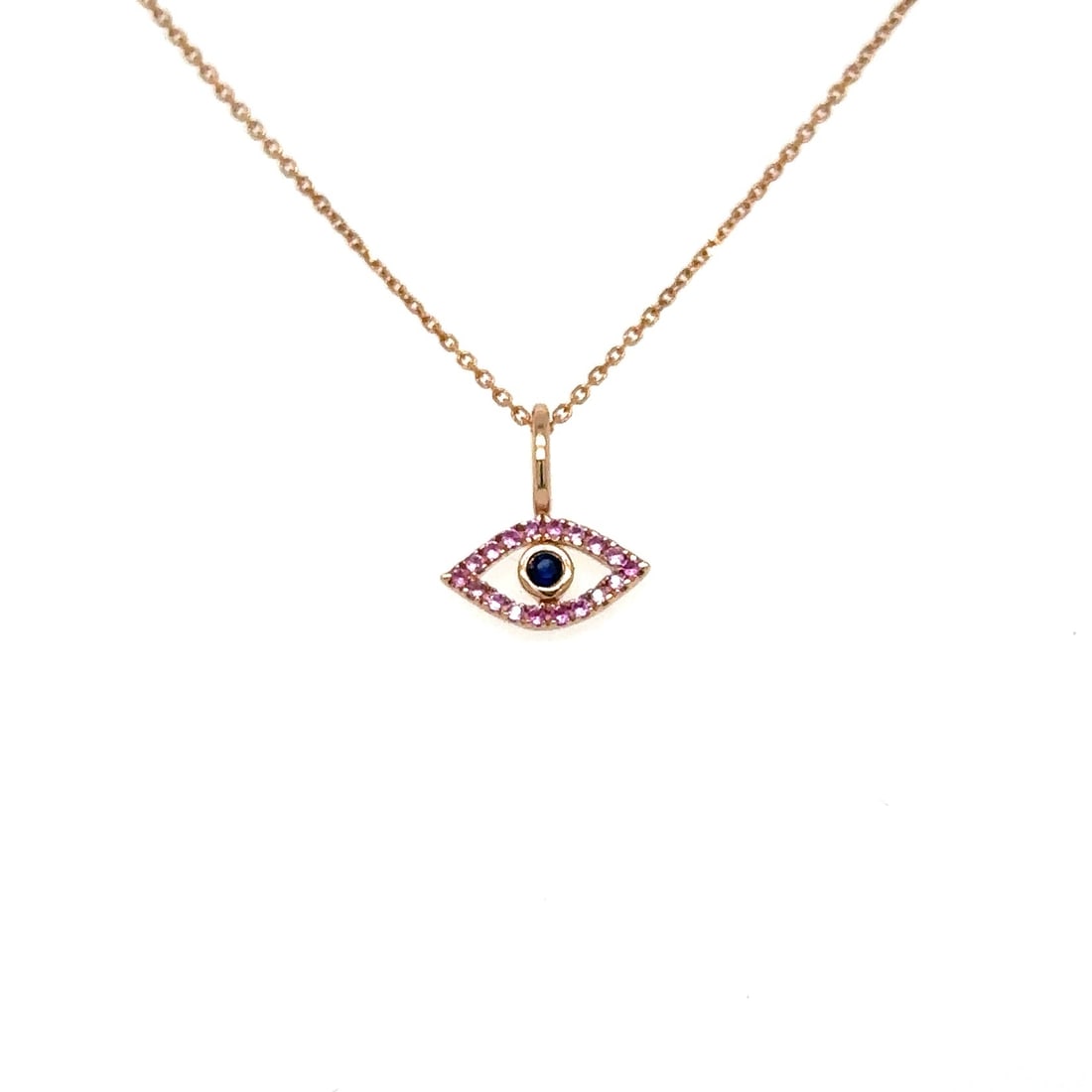 14KT ROSE GOLD PINK SAPPHIRE EVIL EYE PENDANT: 14KT ROSE GOLD PINK SAPPHIRE EVIL EYE PENDANT14KT ROSE GOLD WT. APPROX. 0.37 GRAMSAPPHIRE WT. APPROX. 0.07 CARAT / 19 PCSSIZE: APPOX. 9.40 MM X 10.20 MMPRICE IS ONLY FOR PENDANT WITHOUT CHAIN