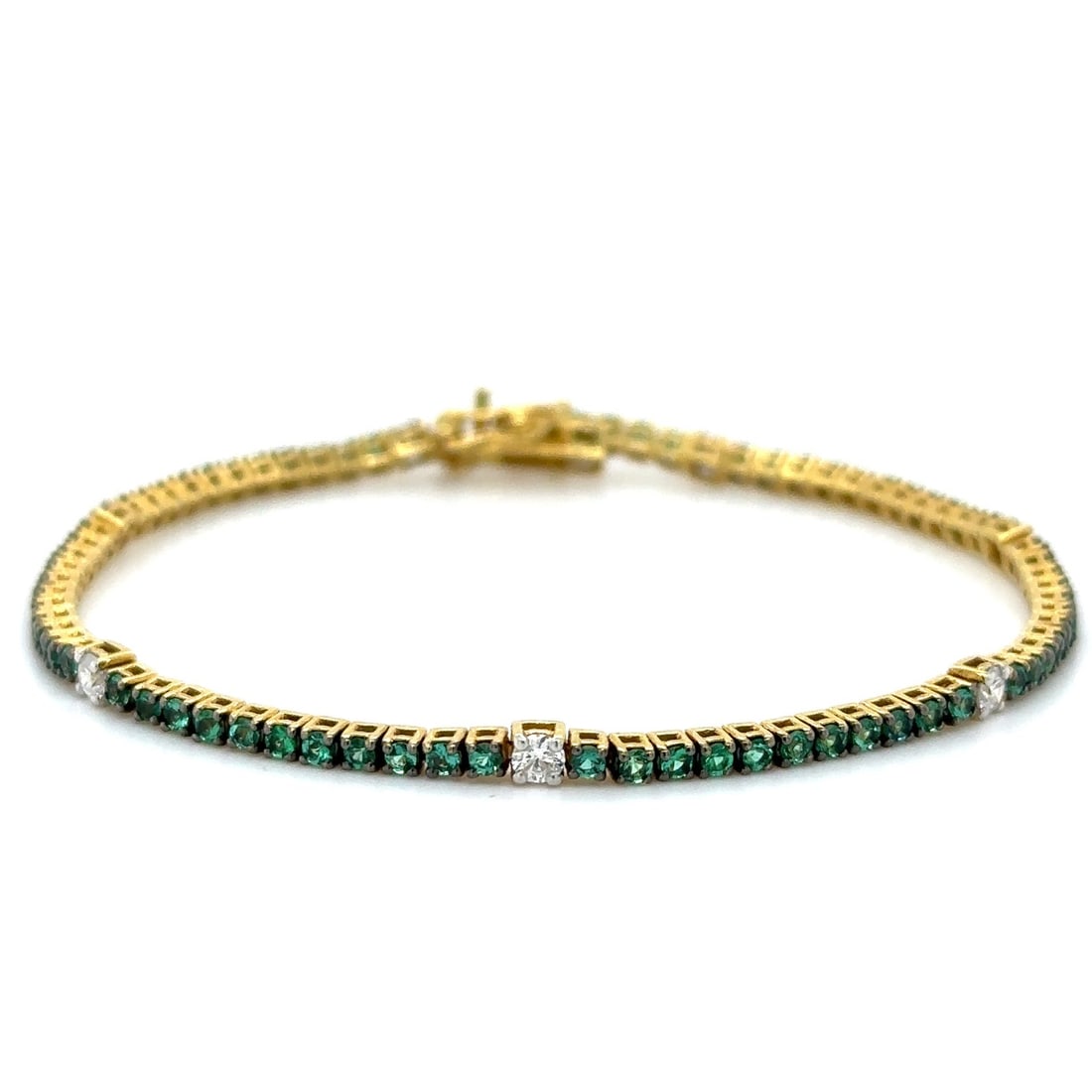 18K YELLOW GOLD EMERALD AND DIAMOND TENNIS BRACELET (1 of 3)