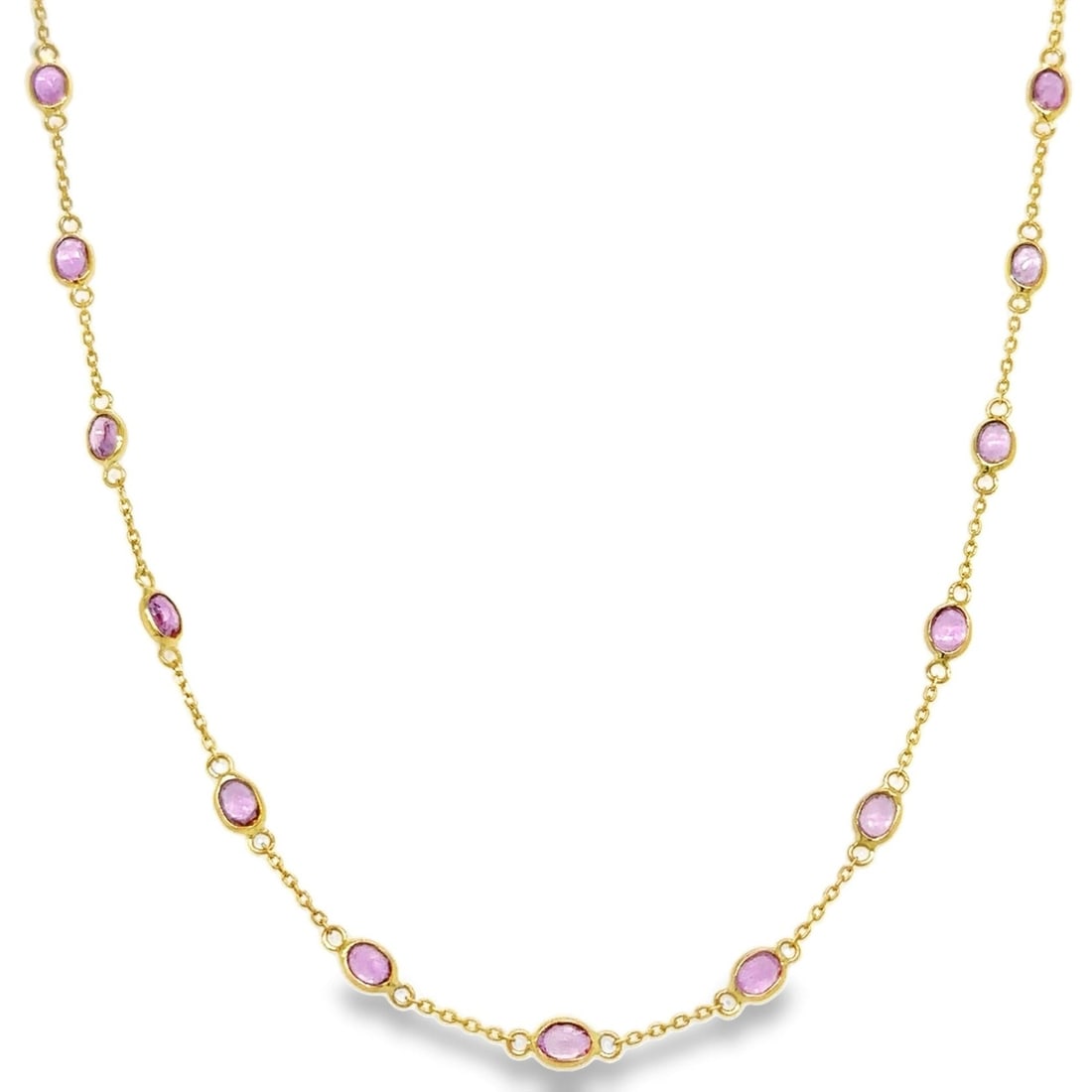 18KT YELLOW GOLD PINK SAPPHIRE STATION NECKLACE: 18KT YELLOW GOLD PINK SAPPHIRE STATION NECKLACE18KT GOLD WT. APPROX. 2.73 GRAMSAPPHIRE WT. APPROX. 4.99 CARAT18" LONG WITH ADJUSTABLE RING ON 16" AND 17"