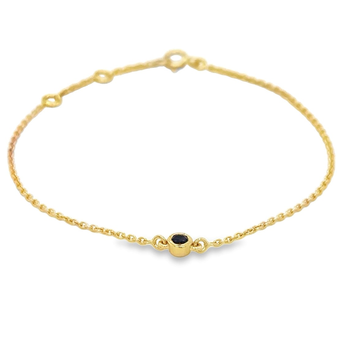 14KT YELLOW GOLD SAPPHIRE BRACELET: 14KT YELLOW GOLD SAPPHIRE BEZEL CHAIN BRACELET 7"14KT GOLD WT. APPROX. 1.18 GRAMSAPPHIRE WT. APPROX. 0.15 CARATEXTENDER RING ON 6" AND 6.5"