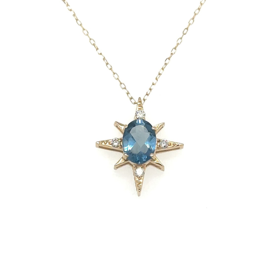 14KT YELLOW GOLD STARBURST PENDANT WITH TOPAZ AND DIAMONDS: 14KT YELLOW GOLD STARBURST PENDANT WITH TOPAZ AND DIAMONDS 18"14KT GOLD WT. APPROX. 1.65 GRAMDIAMOND WT. APPROX. 0.10 CARAT / 4 PCSTOPAZ WT. APPROX. 1.40 CARAT18" LONG CHAIN WITH ADJUSTABLE RING ON 16