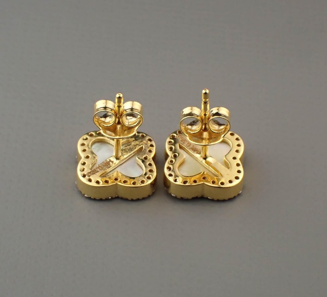 DIAMOND, MOTHER-OF-PEARL AND 14K GOLD EARRINGS: DIAMOND, MOTHER-OF-PEARL AND 14K GOLD EARRINGS, each yellow gold having a mother-of-pearl Alhambra clover accented with round-cut diamonds. The earrings together weigh 2.9 grams and are stamped "14K" 
