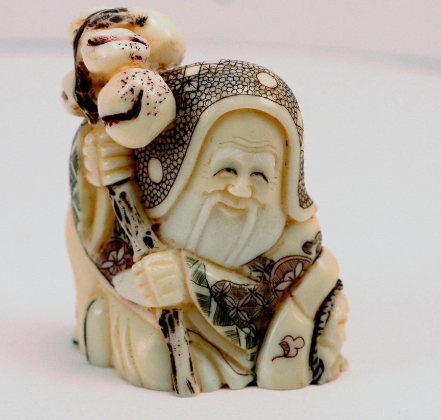 Ivory Netsukes of Old Man Sitting.: Ivory Nesukes of old man sitting - signed.