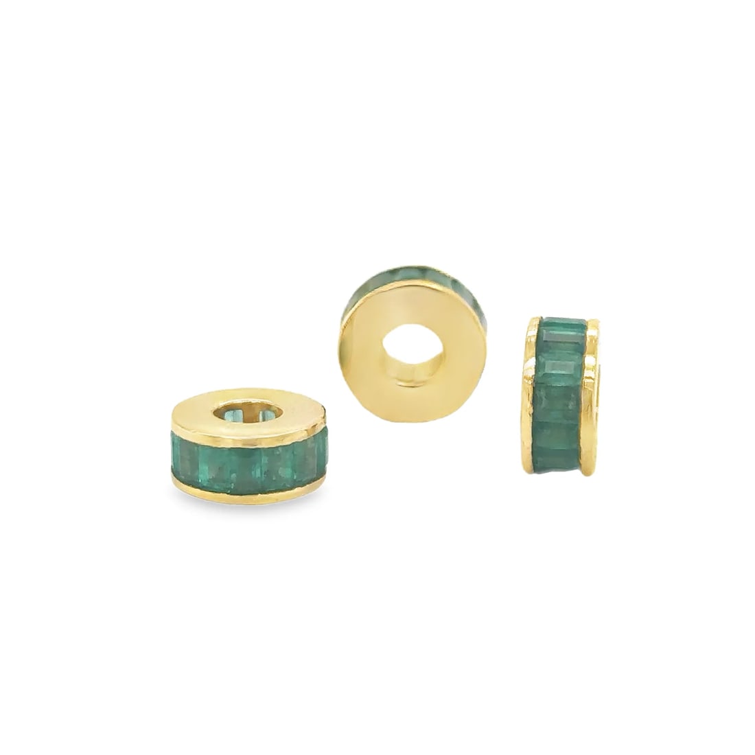 14KT YELLOW GOLD EMERALD BAGUETTE RONDELLES: 14KT YELLOW GOLD EMERALD BAGUETTE RONDELLES14KT GOLD WT. APPROX. 1.31 GRAMEMERALD WT. APPROX. 1.26 CARATSIZE: APPROX. 10 MM