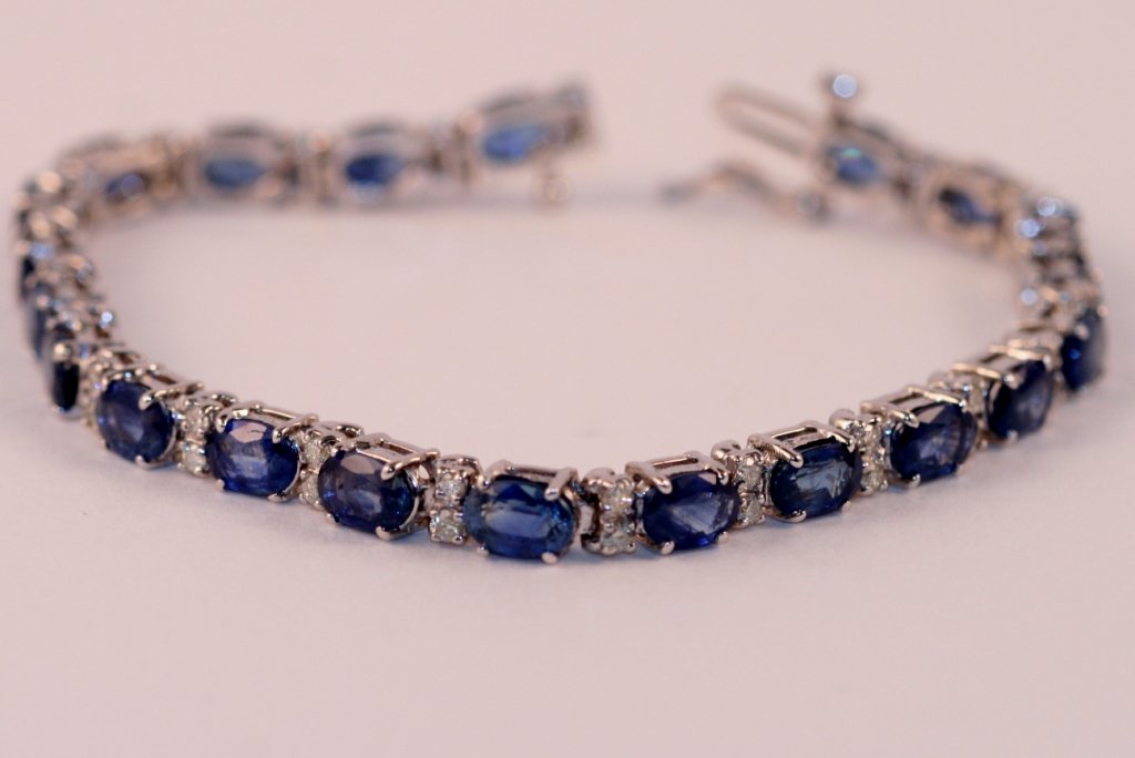 14k White Gold Diamond and Sapphire Bracelet.: One ladies 14k white diamond and sapphire bracelet, weighting 13 grams. The total diamond weight is .80carats. The total sapphire weight is 11.30 carats. Value $4200.00