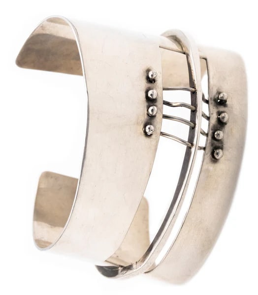 Ed Wiener 1950 New York Constructivist Sculptural Cuff Bracelet In .925 Sterling Silver: A cuff bracelet designed by Ed Wiener (1918-1991).This rare sculptural modernist piece is one of Wiener's first creations as a jeweler-artist in New York city, circa 1950's. This bracelet is composed