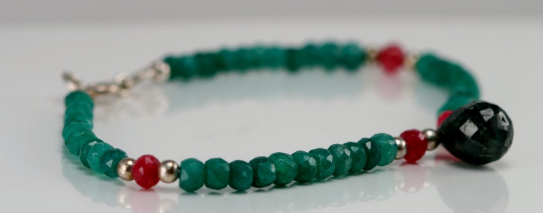 EMERALD & RUBY BRACELET: ONE EMERALD & RUBY BRACELET WITH SILVER CLASP.