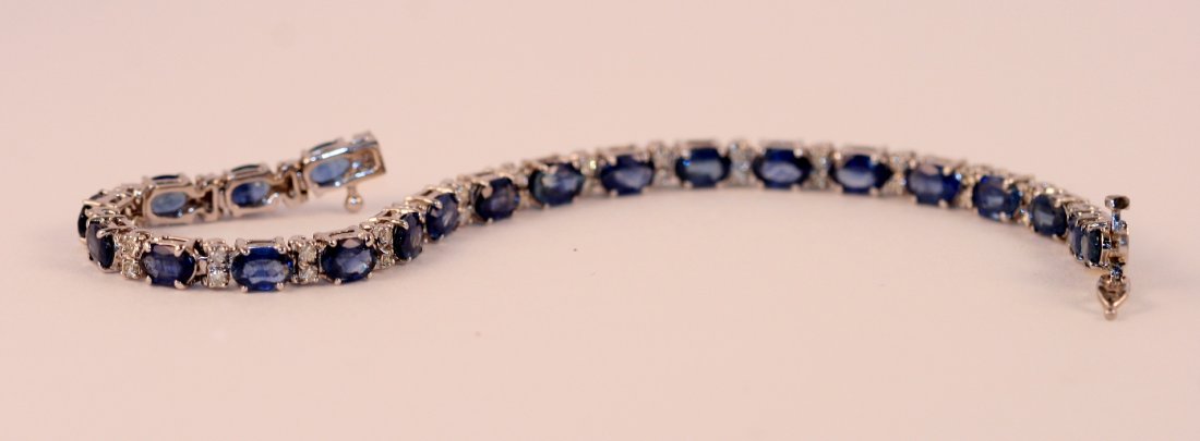 14k White Gold Diamond and Sapphire Bracelet.: One ladies 14k white diamond and sapphire bracelet, weighting 13 grams. The total diamond weight is .80carats. The total sapphire weight is 11.30 carats. Value $4200.00