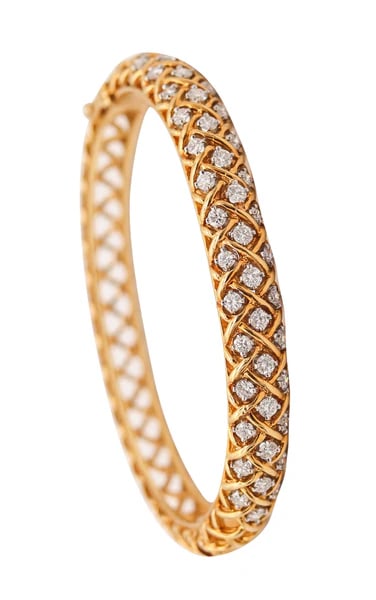 McTEIGUE 1970 Bangle Bracelet In 18Kt Gold & Platinum With 2.30 Ctw VS Diamonds: Bangle bracelet designed by McTeigue.This is an exceptional modernist bangle-bracelet created by the jewelry designers of McTeigue, back in the 1970. The bracelet was crafted as an intricate lattice i