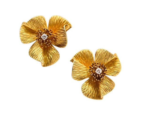 CARTIER 1950 Floriated Clips-On Earrings In 18Kt Gold With VS Diamonds: Clips on earrings designed by Cartier.This is a fabulous pair of clips-on earrings created during the post-war and the mid-century periods by the French jewelry house of Cartier, back in the 1955. Thi