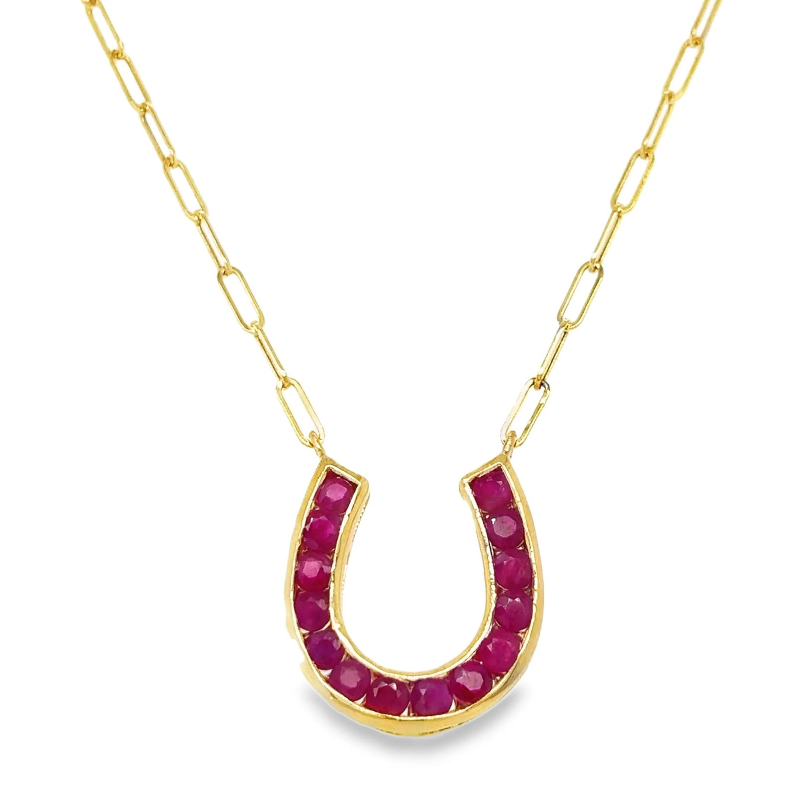 14KT YELLOW GOLD RUBY HORSESHOE NECKLACE: 14KT YELLOW GOLD RUBY HORSESHOE NECKLACE14KT GOLD WT. APPROX. 3.60 GRAMRUBY WT. APPROX. 2.08 CARAT/ 14 PCS18 INCH LONG