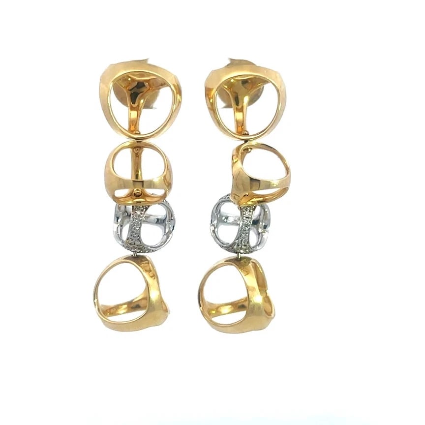 Modolo Gold Triadra Earrings Diamond Pave Set 18k Two Tone Dangle Style: This chic and fashionable Di Modolo earrings are from the Triadra Collection. They are a stunning pair of dangle style earrings featuring open ball motifs in polished yellow gold with one ball in whit