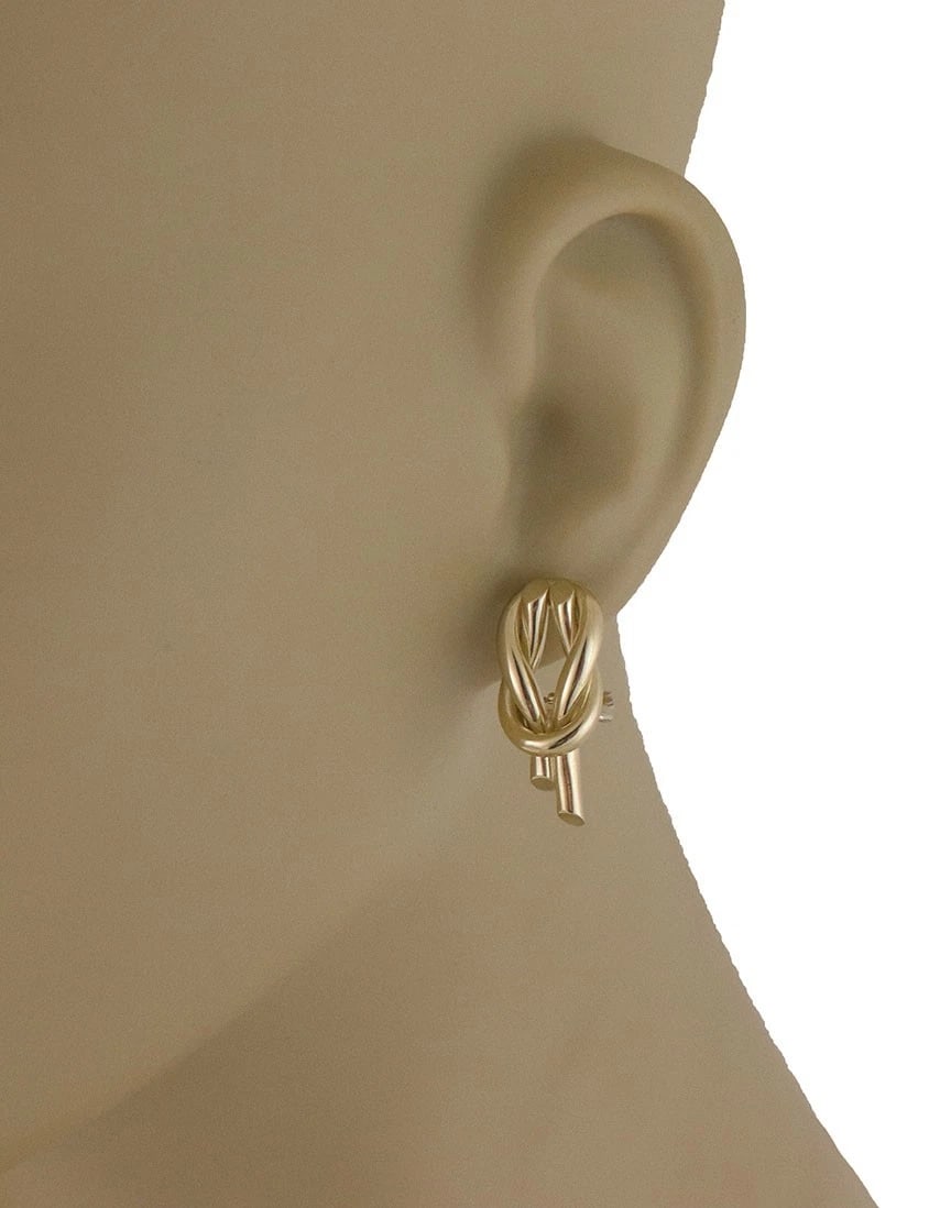 Roberto Coin Gold Circle Knot Earrings 18k Yellow Post Clip Huggie Style: The Roberto Coin Gold Circle Knot Earrings are a luxurious and stylish addition to any jewelry collection. Made of 18k yellow gold, these huggie style earrings feature the beautiful scarf atame knot