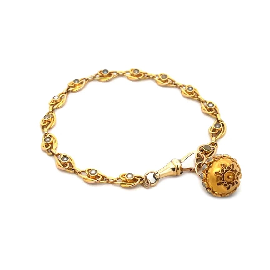 Victorian Gold Pearls Bracelet 18k 14k Yellow Floral Ball Chain Link: Experience the elegance of the Victorian era with this exquisite gold pearls bracelet or watch fob. Crafted during the period when opulence and intricate design were paramount, this piece showcases a