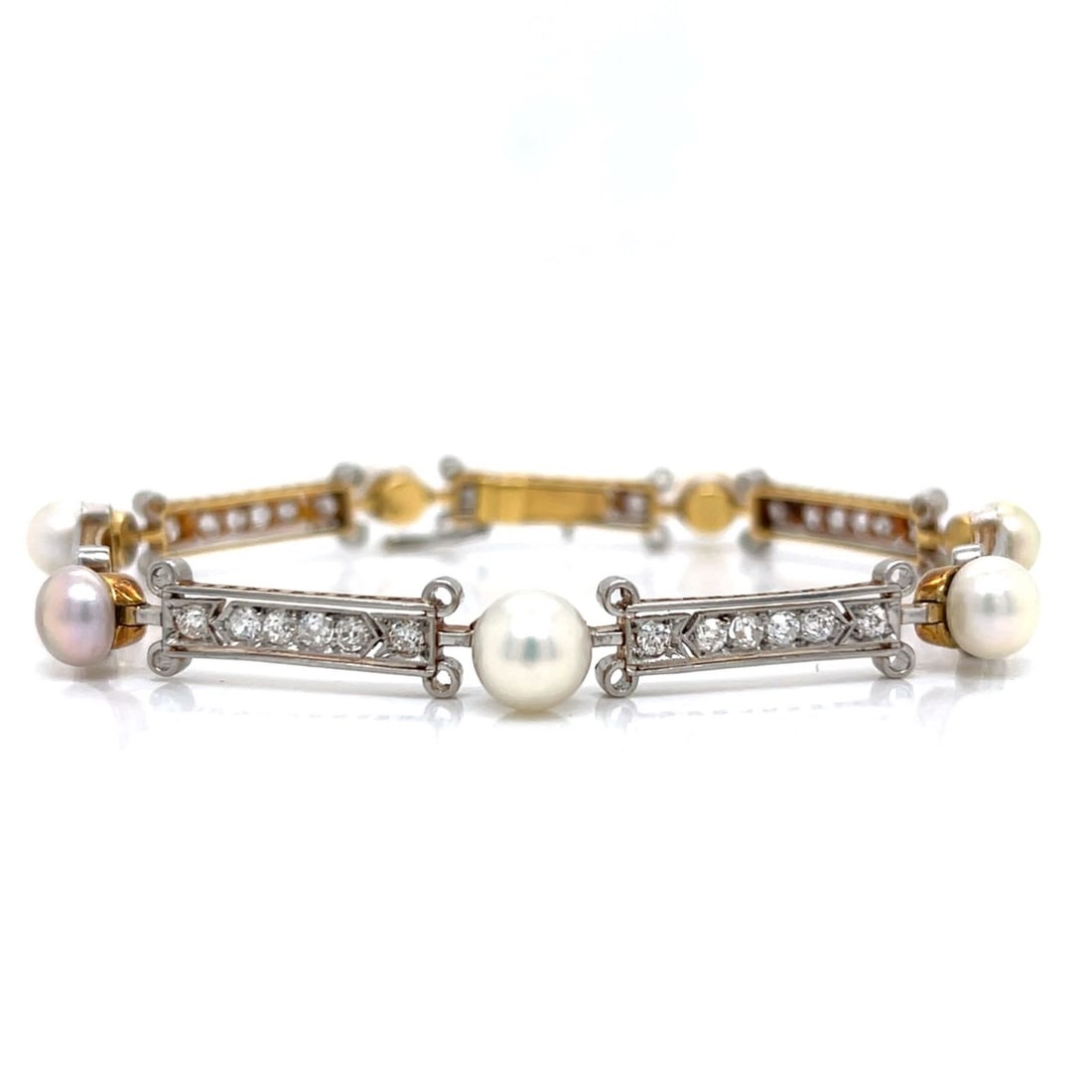 Edwardian 18K & Platinum GIA Certified Natural Pearl and Diamond Bracelet: Edwardian 18K & Platinum GIA Certified Natural Pearl and Diamond BraceletWeighing 17.1 gramsSet with GIA Certified Natural PearlsAlong with 41 Old Mine Diamonds weighing app. 3.20 Ct.F-G Color,