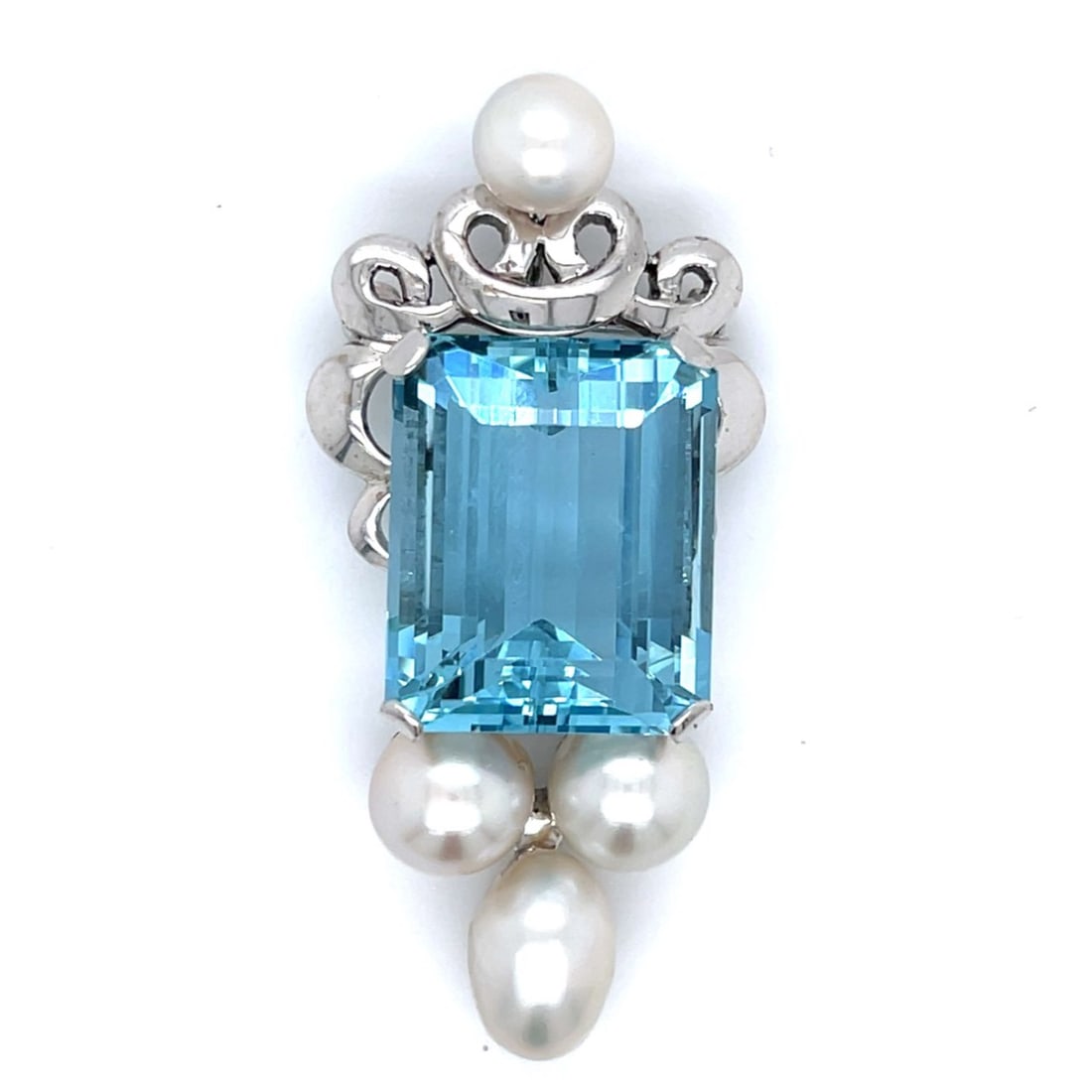 1960’s 14K White Gold Aquamarine & Pearl Pendant/Brooch: 1960’s 14K White Gold Aquamarine & Pearl Pendant/BroochWeighing 13.6 gramsSet with an app. 20.00 Ct. Aquamarine19.5 x 16.0 x 11.25mmAlong with 4 Pearls measuring app.7.10 – 10.65 x 7.55mm2.25 x 1