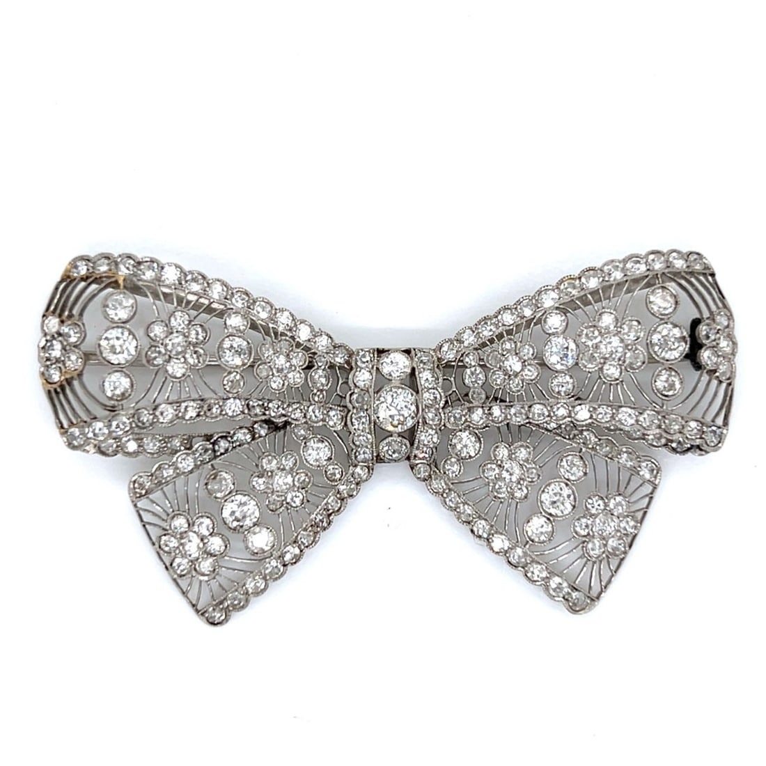 Belle Epoque Platinum Diamond Bow Brooch: Belle Epoque Platinum Diamond Bow BroochWeighing 16.1 gramsSet with 205 Old Mine Diamonds weighing app. 10.00 Ct.F-H Color, VS1-SI2 Clarity2.5 x 1.25 inches