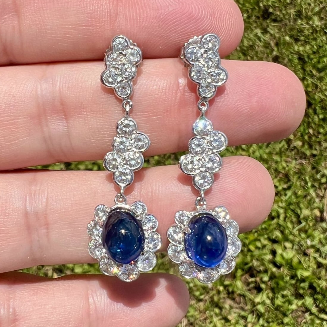 Platinum & 14K White Gold Sapphire and Diamond Earrings: Platinum & 14K White Gold Sapphire and Diamond EarringsWeighing 9.0 gramsSet with 2 Sapphire Cabochons weighing app. 8.00 Ct.9.10 x 7.35 x 6.00mmAlong with 42 Diamonds weighing app. 3.50 Ct.F-G
