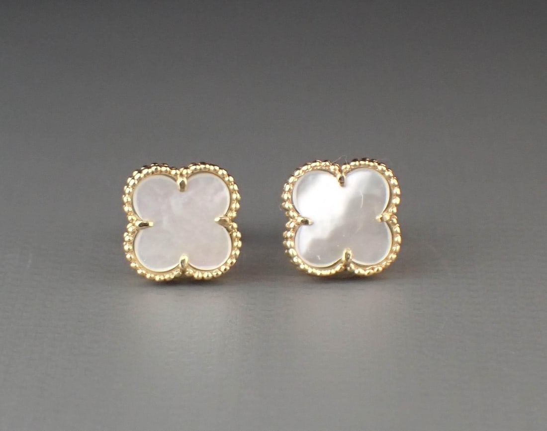 DIAMOND, MOTHER-OF-PEARL AND 14K GOLD EARRINGS: DIAMOND, MOTHER-OF-PEARL AND 14K GOLD EARRINGS, each yellow gold having a mother-of-pearl Alhambra clover accented with round-cut diamonds. The earrings together weigh 2.9 grams and are stamped "14K"