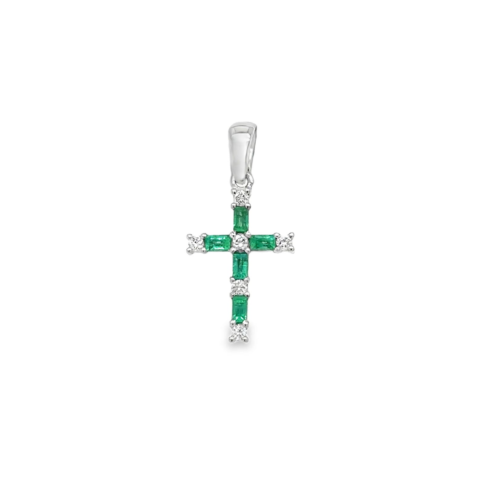 14KT WHITE GOLD EMERALD AND DIAMOND CROSS PENDANT: 14KT WHITE GOLD EMERALD AND DIAMOND CROSS PENDANT 14KT GOLD WT. APPROX. 0.58 GRAMDIAMOND WT. APPROX. 0.06 CARAT / 06 PCSEMERALD WT. APPROX. 0.15 CARAT / 05 PCSSIZE APPROX. - 13 MM X 9 MM (WITHOUT